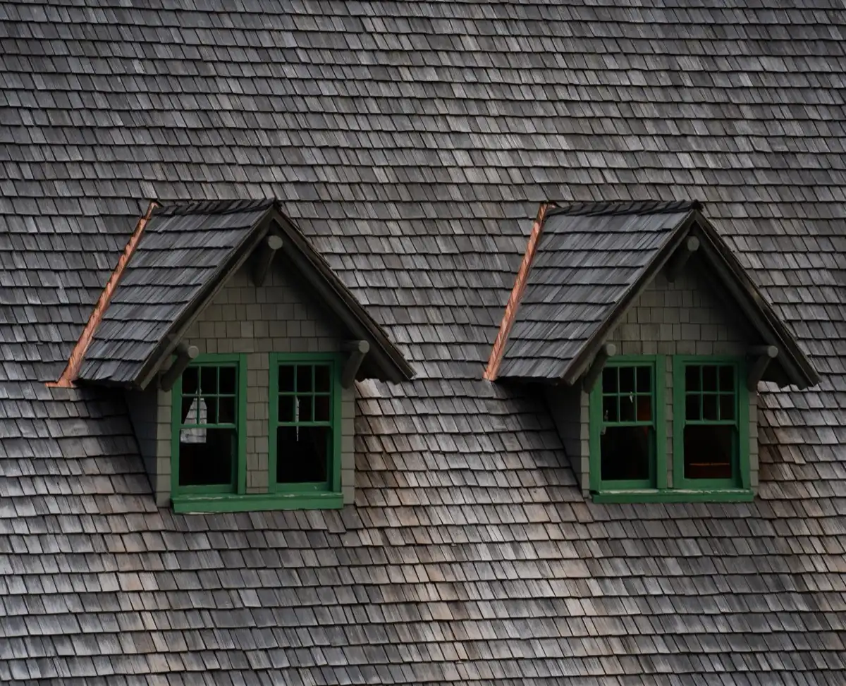 Dormers on a shingle roof in Norwalk, CT, where step flashing and kickout flashing carry water past the walls